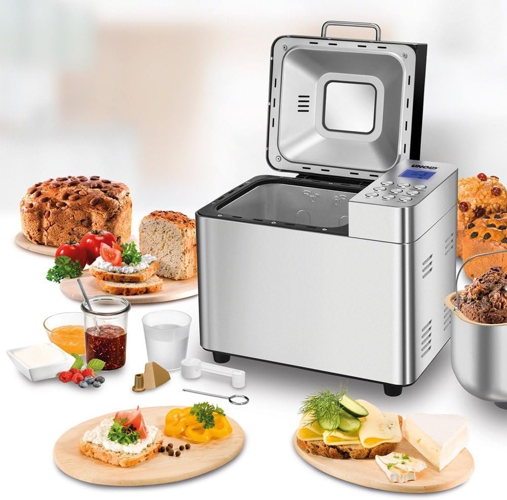 Panificadora Unold 68456 con tapa abierta y mezcla de ingredientes