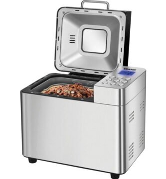 Panificadora 68456 Edel Unold con tapa abierta y mezcla de ingredientes